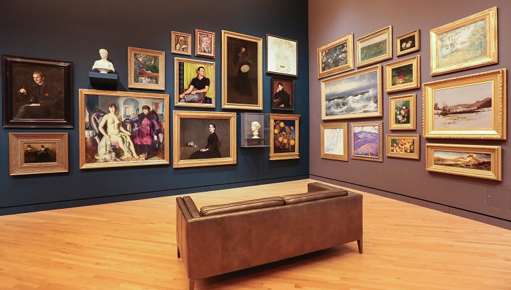 gallery with paintings on a wall