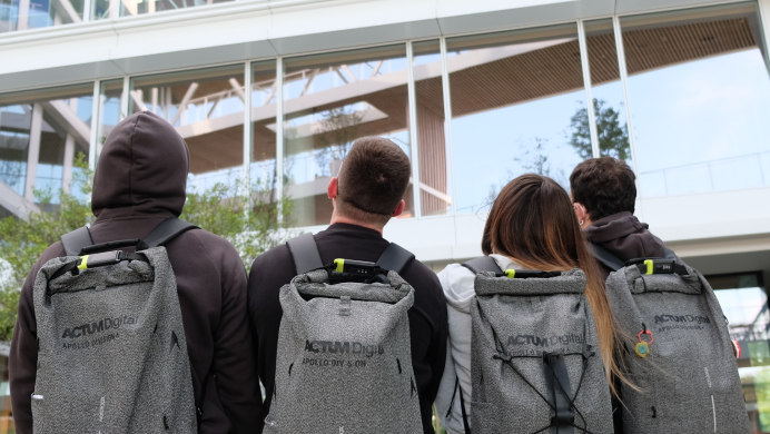 Apollo team in front of the office building with their Apollo Backpacks