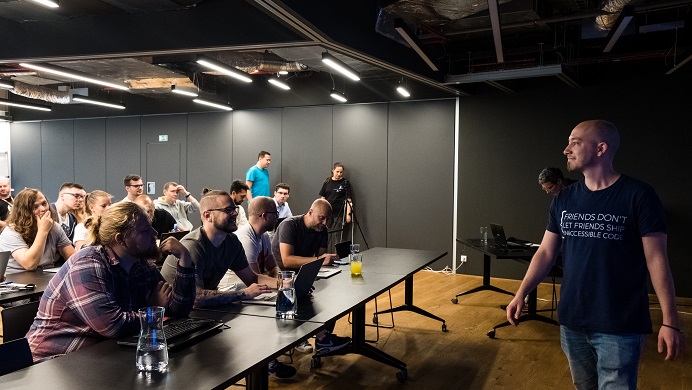 audience on a seminar with man walking in front