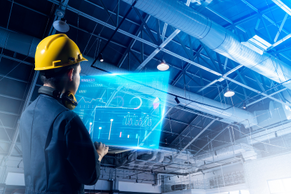 person with tablet at manufacturing production site