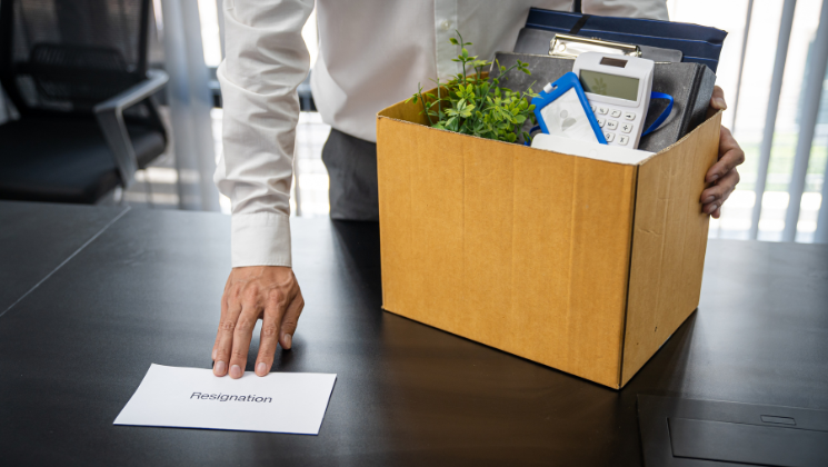 Employee giving a resignation letter 