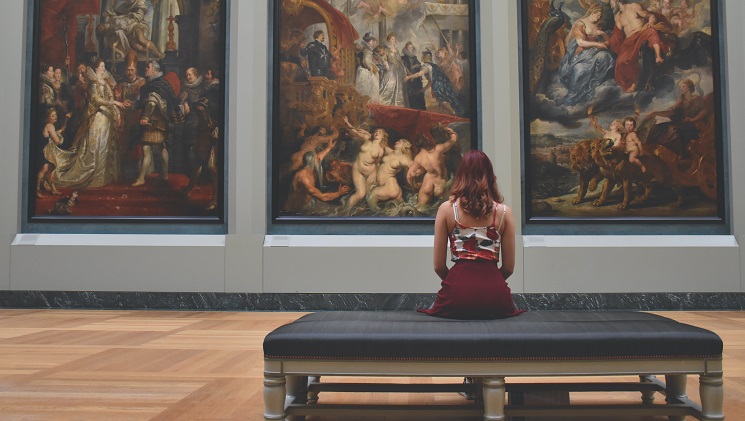 girl sitting in a gallery