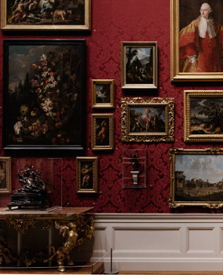 Red gallery wall, paintings